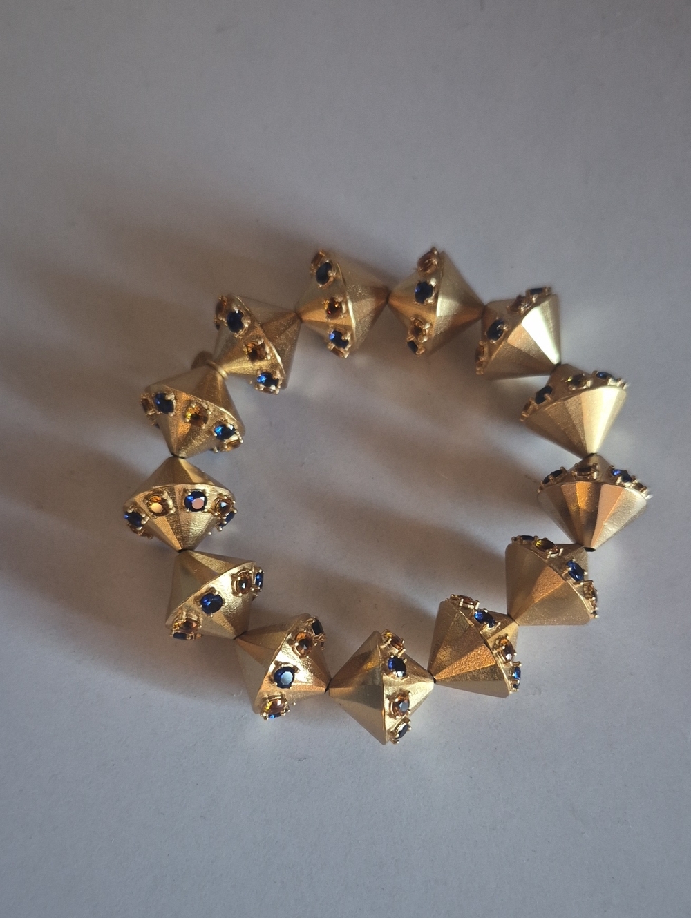 Gold-Tone Pyramid Bracelet with Blue Crystal Accents